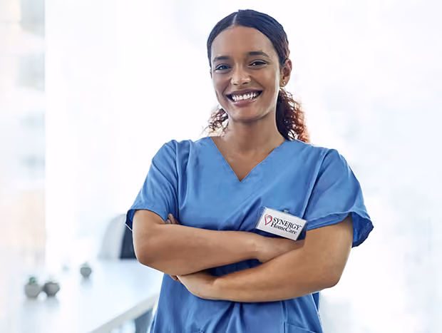 Image of a caregiver posing in front of a camera.