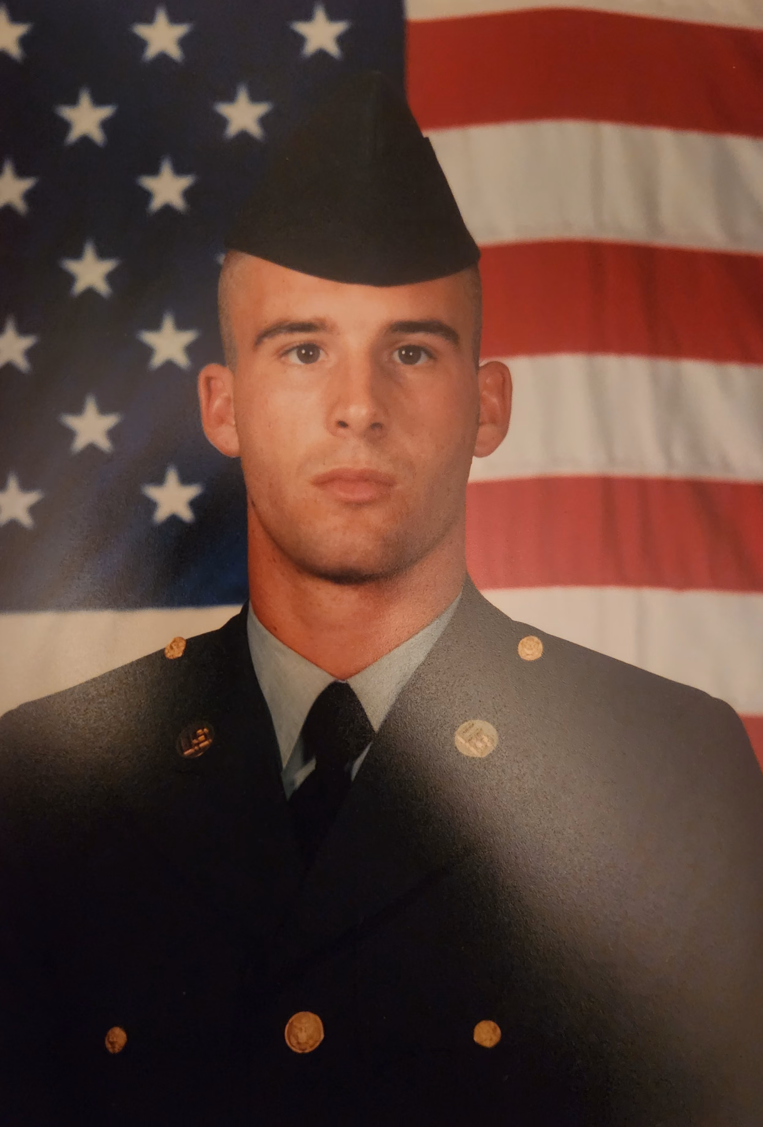 A uniformed photo of Chris Lowe
