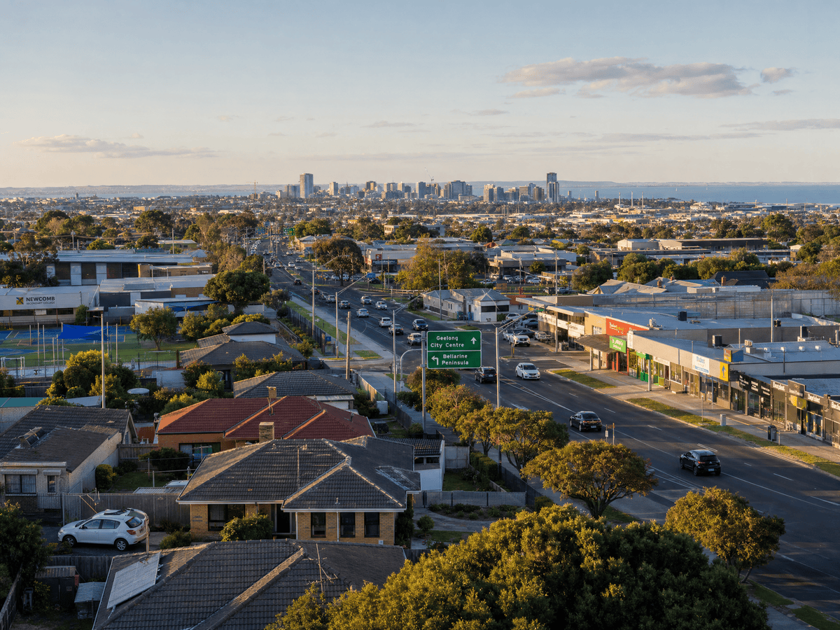 View over modest Newcomb homes and streets towards Geelong CBD and main roads, showing affordable position with practical access and emerging growth potential.