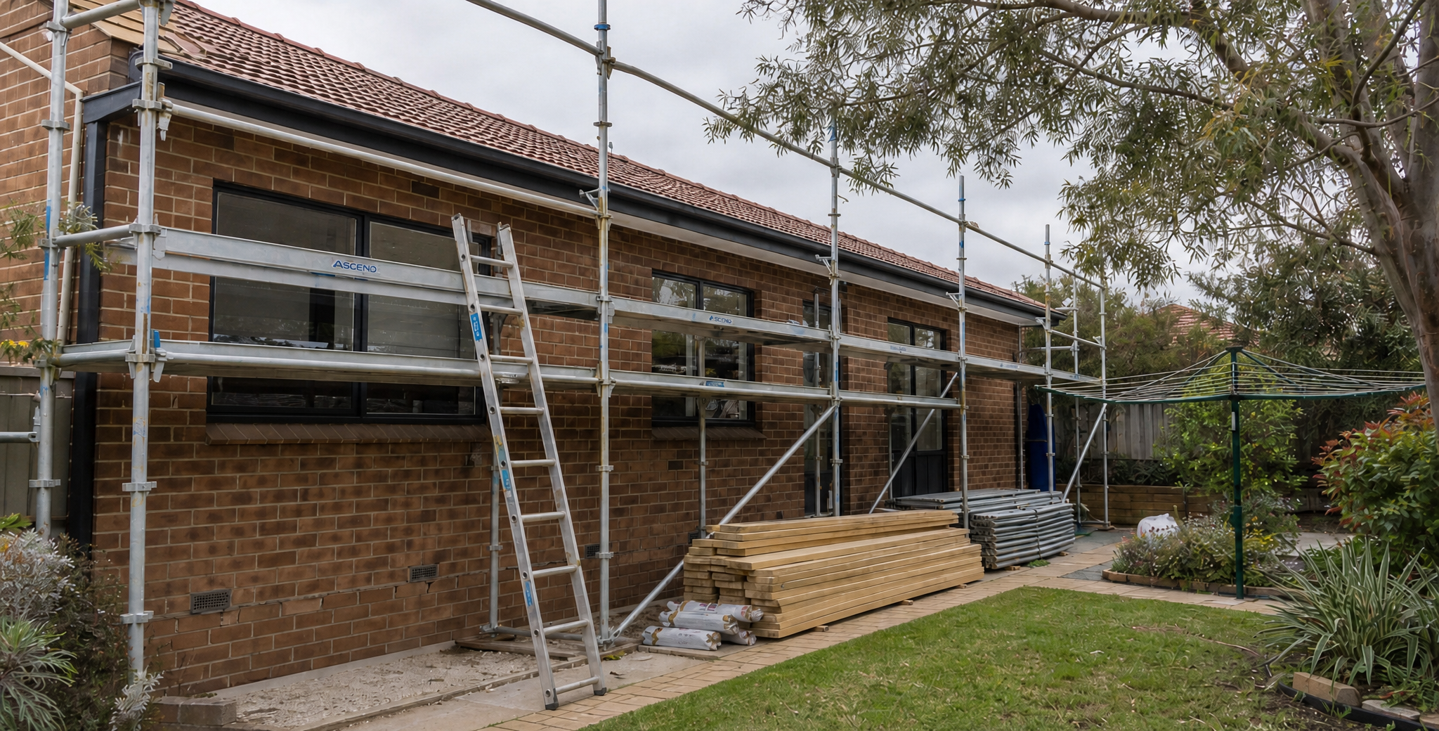 Scaffolding and organised materials on an established Australian home mid- renovation, reflecting coordinated teamwork before pressure builds.