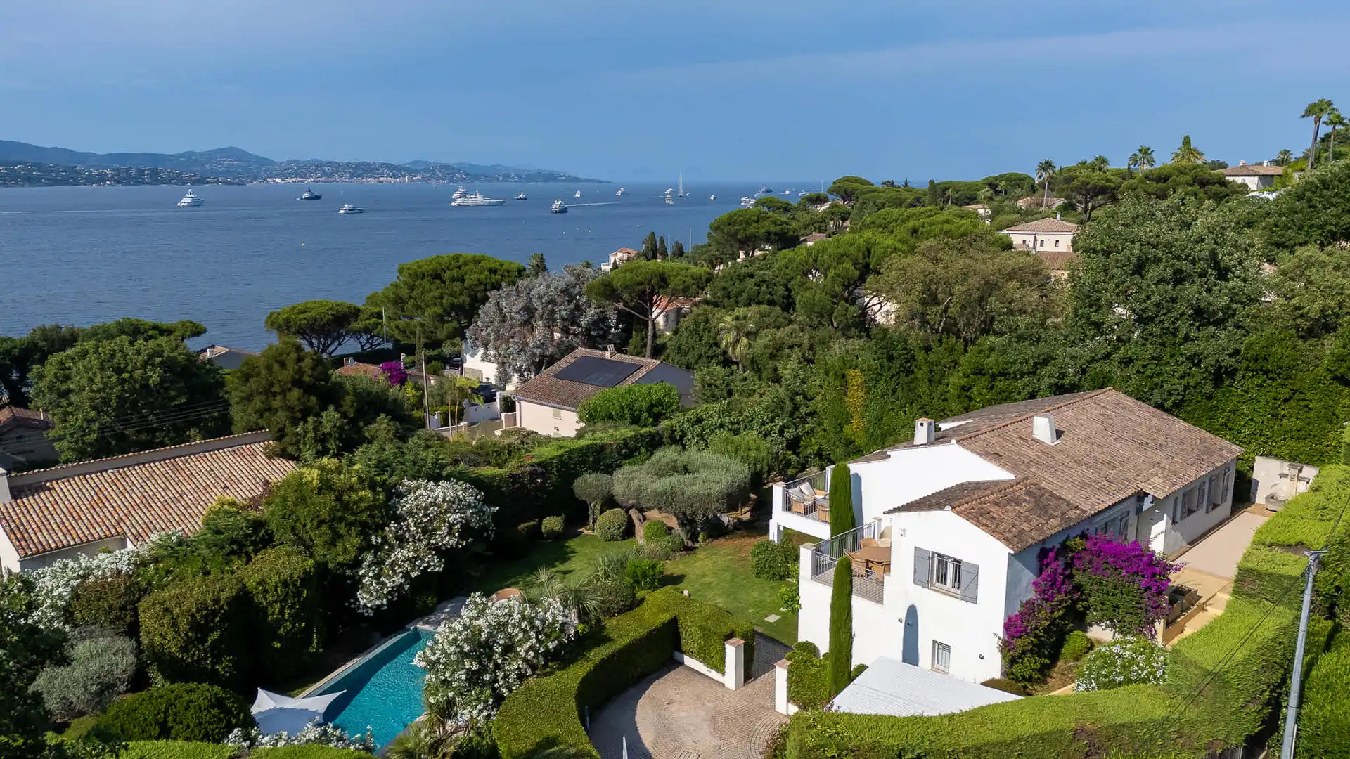 Aerial view over the Gulf of Saint-Tropez with umbrella pines and yachts in the bay