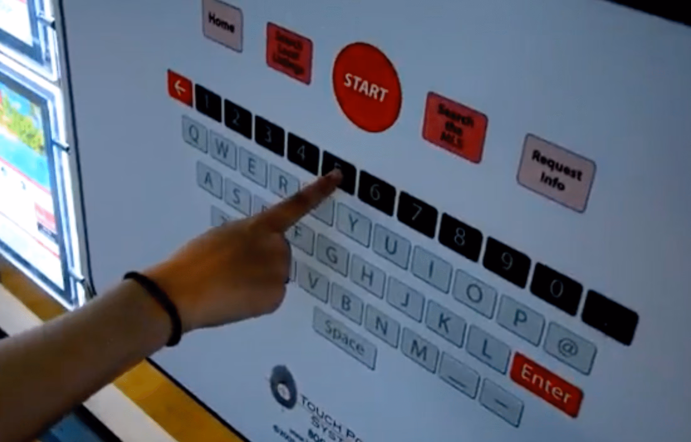 Hand with wristband touching number 5 on a touchscreen keypad with buttons like Start and Enter.