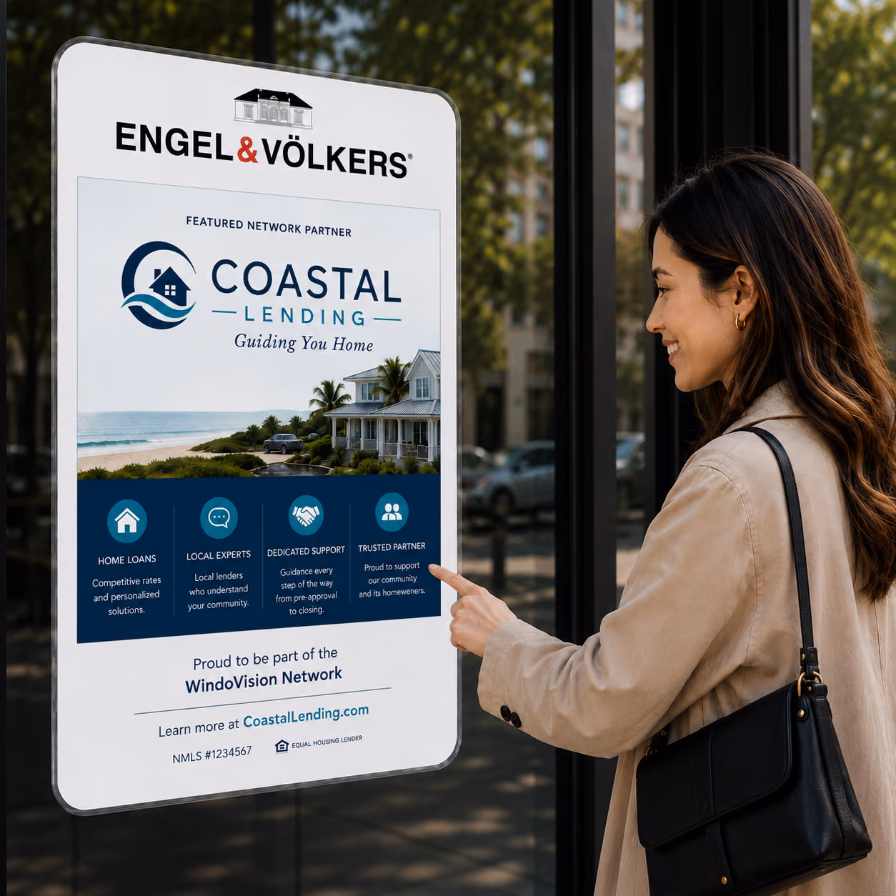 Woman smiling and pointing at Coastal Lending real estate advertisement on glass window.