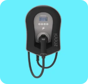 Myenergi Zappi electric vehicle charger mounted on a blue wall with connected charging cable.