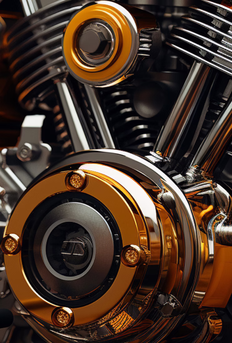 Close-up of a polished motorcycle engine with golden and chrome details.