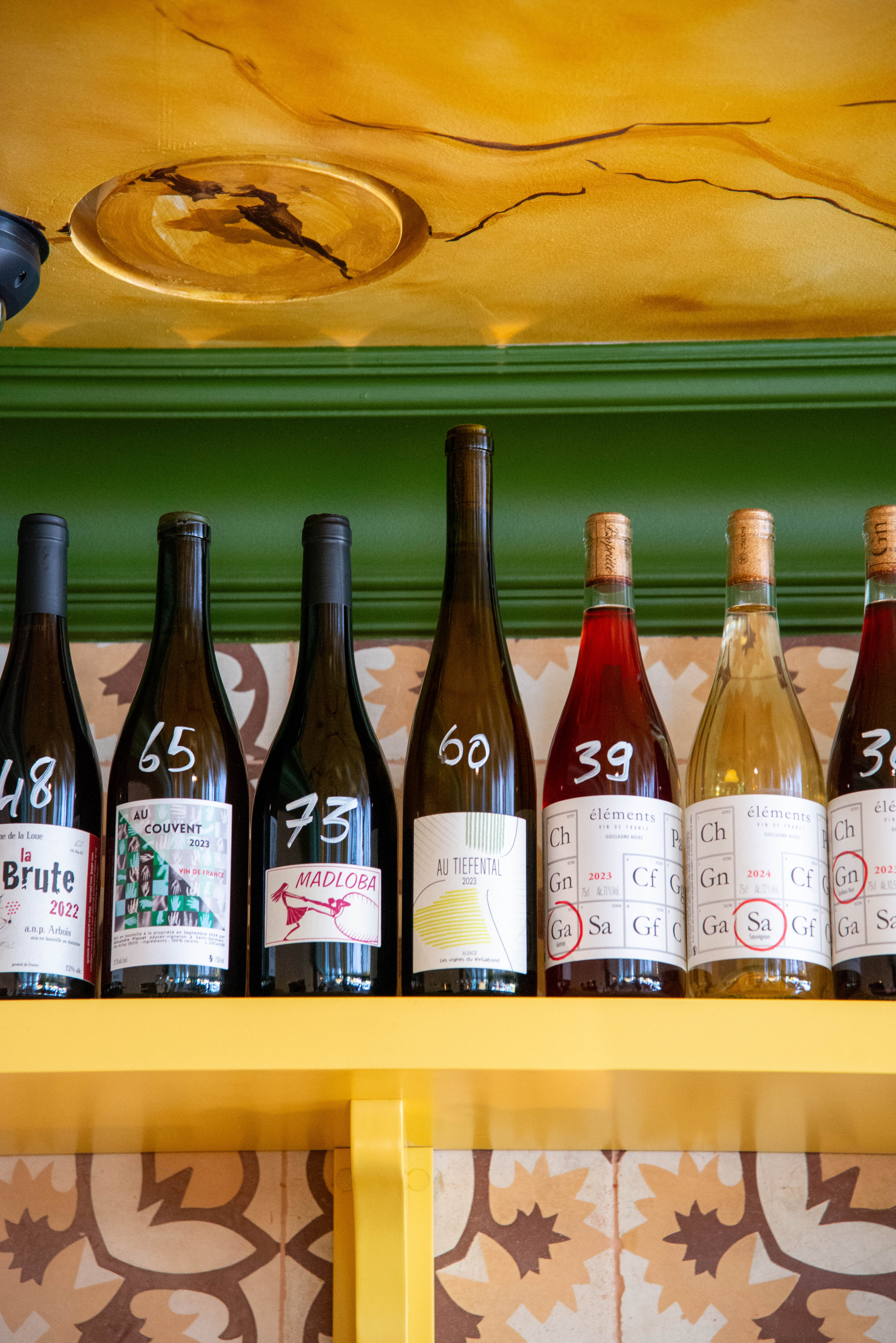 Row of natural wine bottles at Deux Gares Express to end a day in Paris’ 10th arrondissement