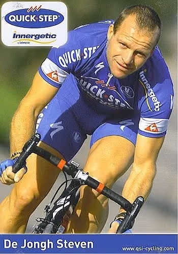Cyclist Steven De Jongh in blue Quick Step Innergetic kit riding a bicycle.