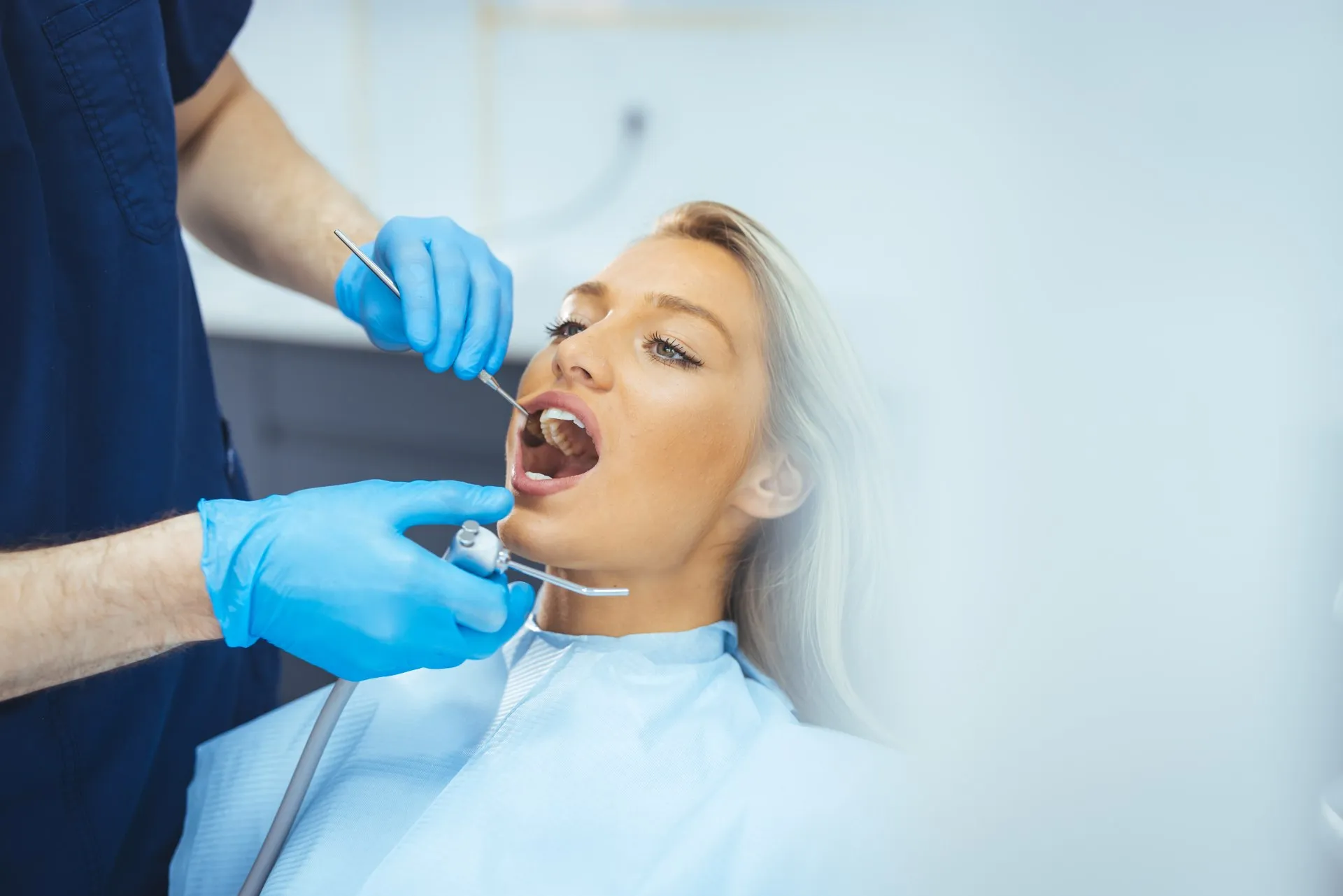 Patient smiling comfortably after receiving a quick, painless cavity filling at Nova Dental Care of Vienna