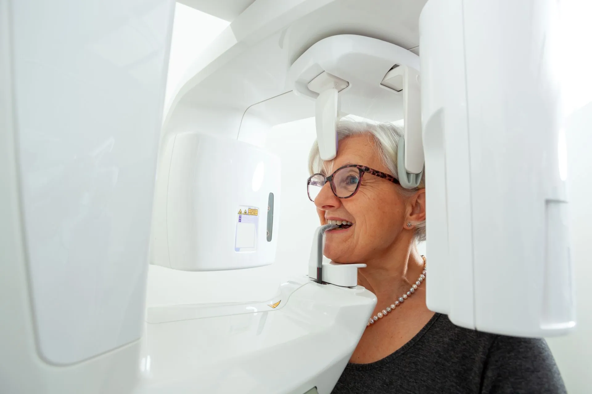 Senior patient receiving a gentle dental examination during a mobile dental visit