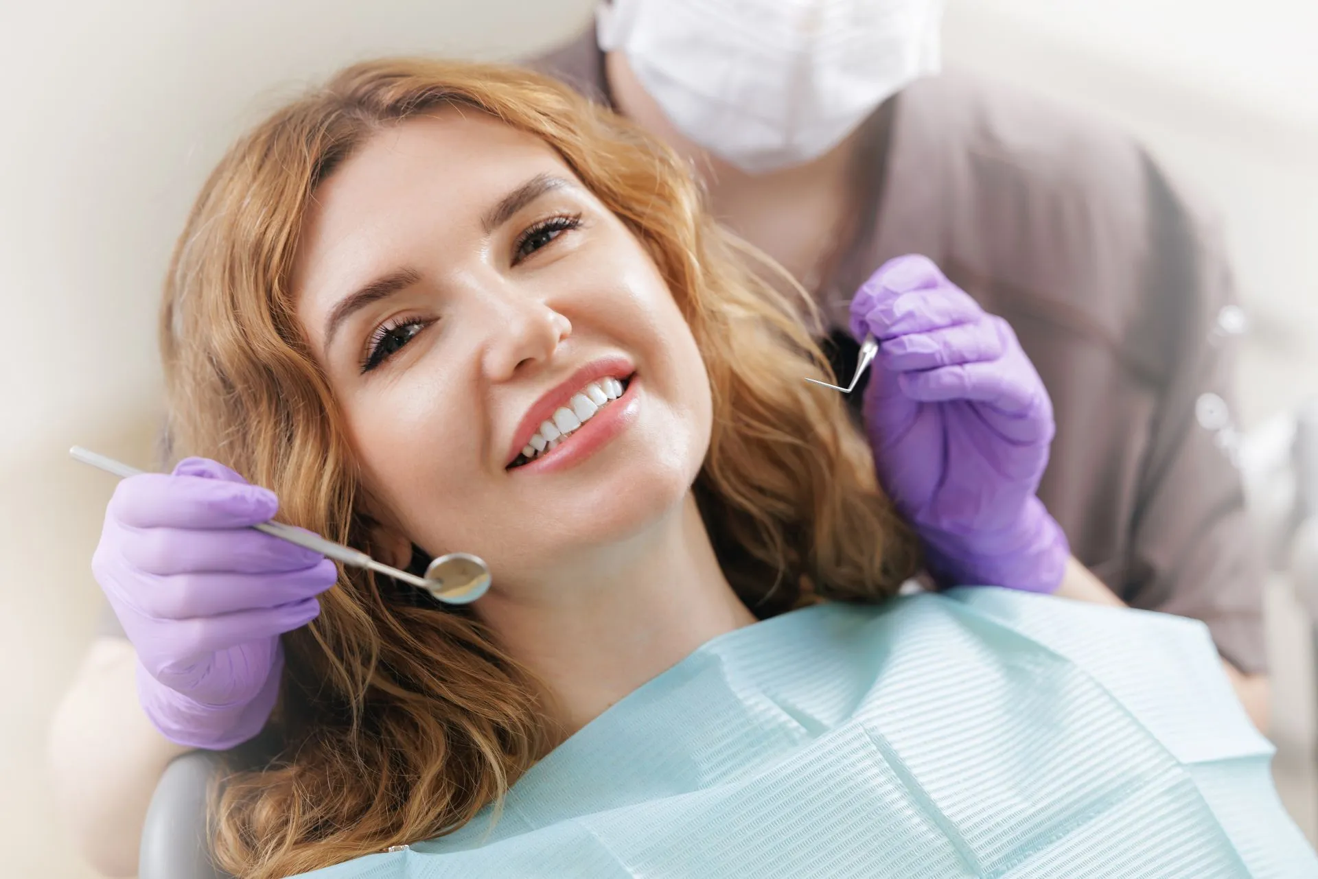 Dentist performing a gentle frenectomy soft tissue procedure using a dental laser