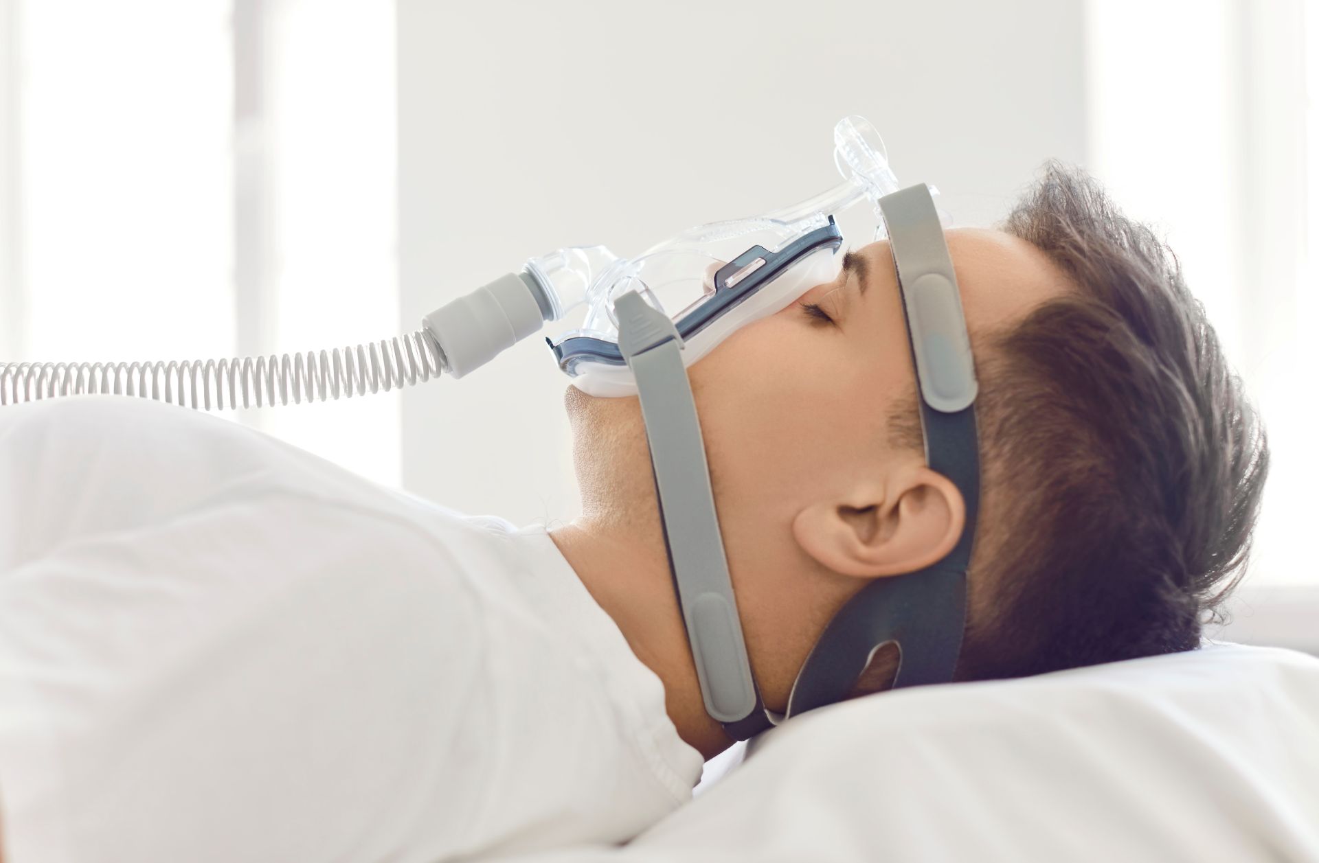 Patient sleeping restfully after receiving oral appliance therapy for sleep apnea at Nova Dental Care of Vienna