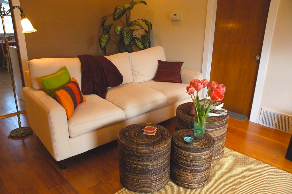 A bright, comfortable living room with a large sofa