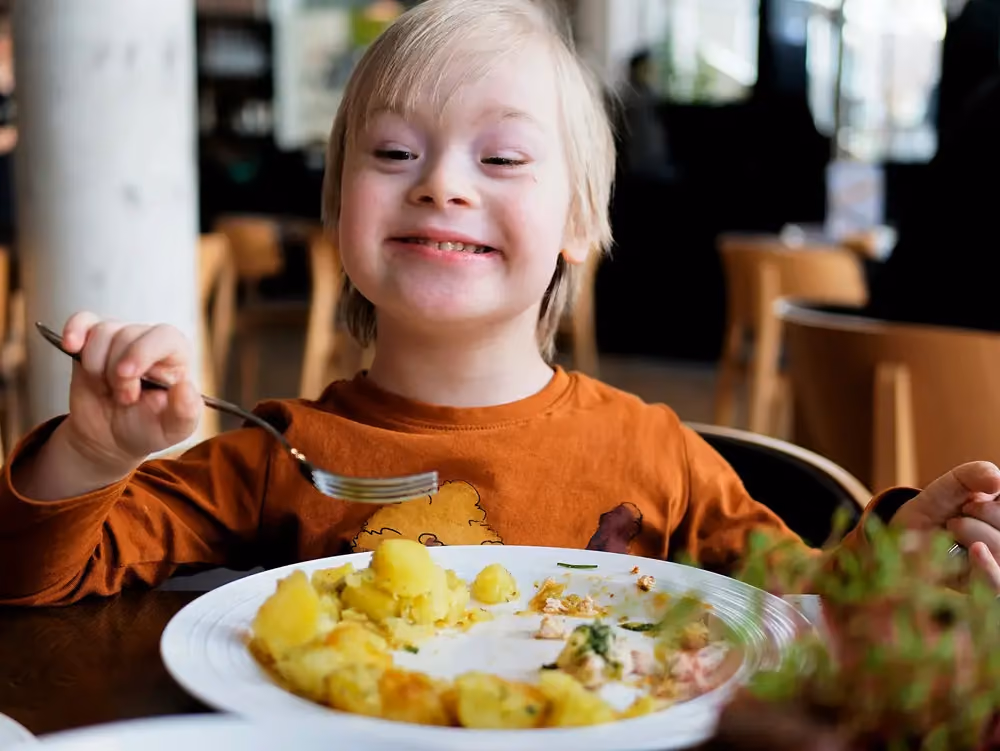 Child eating a meal, stock image