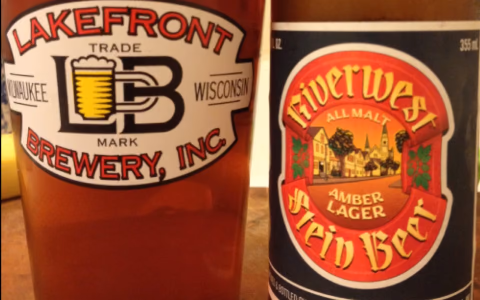 Close-up of two beer labels: Lakefront Brewery, Inc. and Riverwest Stein Beer Amber Lager.