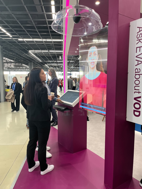 Camino's Ask EVA about VOD interactive booth at a congress