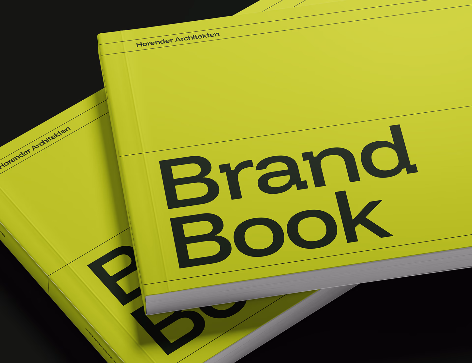 Two yellow-green brand books stacked, titled 'Brand Book' with 'Horender Architekten' on top edge.