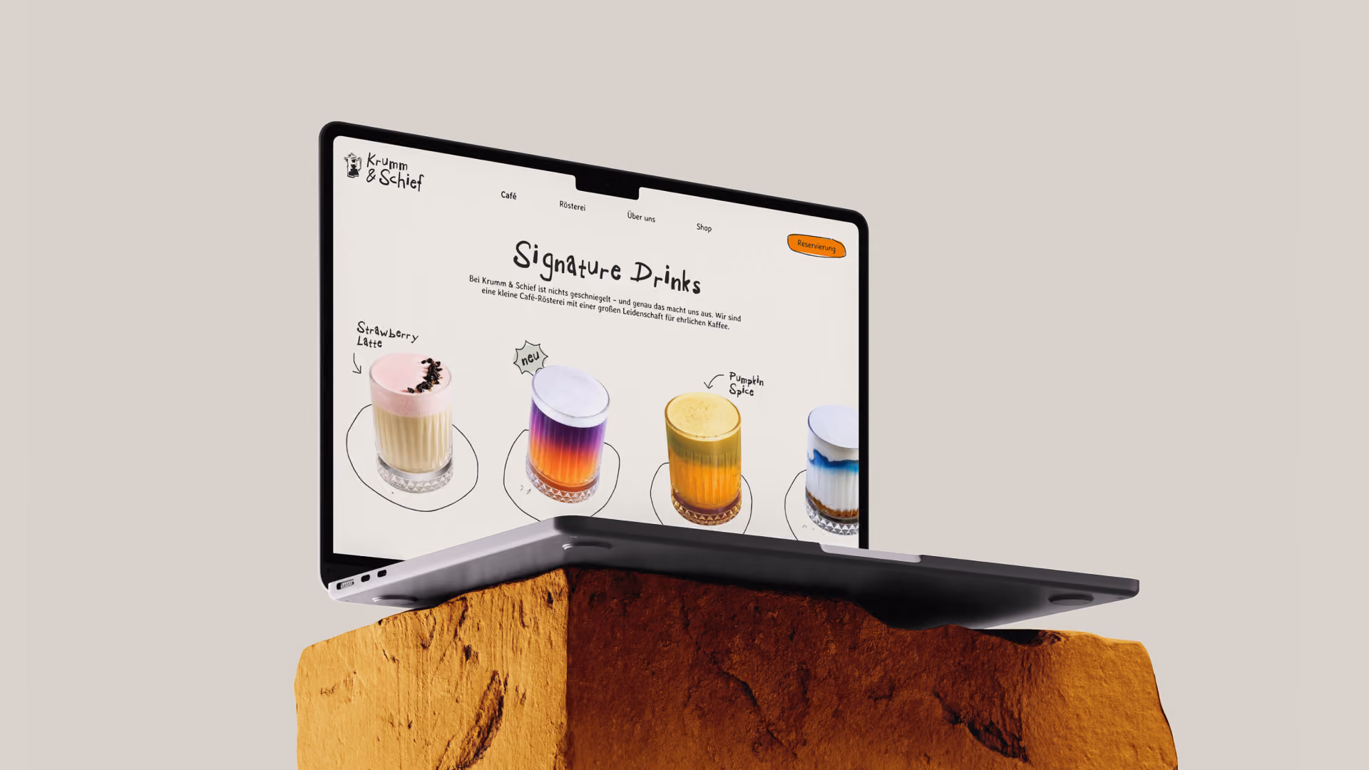 Laptop-Mockup mit der Website eines Getränke-Anbieters, geöffnet auf der Seite "Signature Drinks"