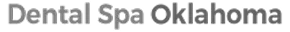 Sign reading 'Dental Spa Oklahoma' with a leaf icon between words on a dark background.