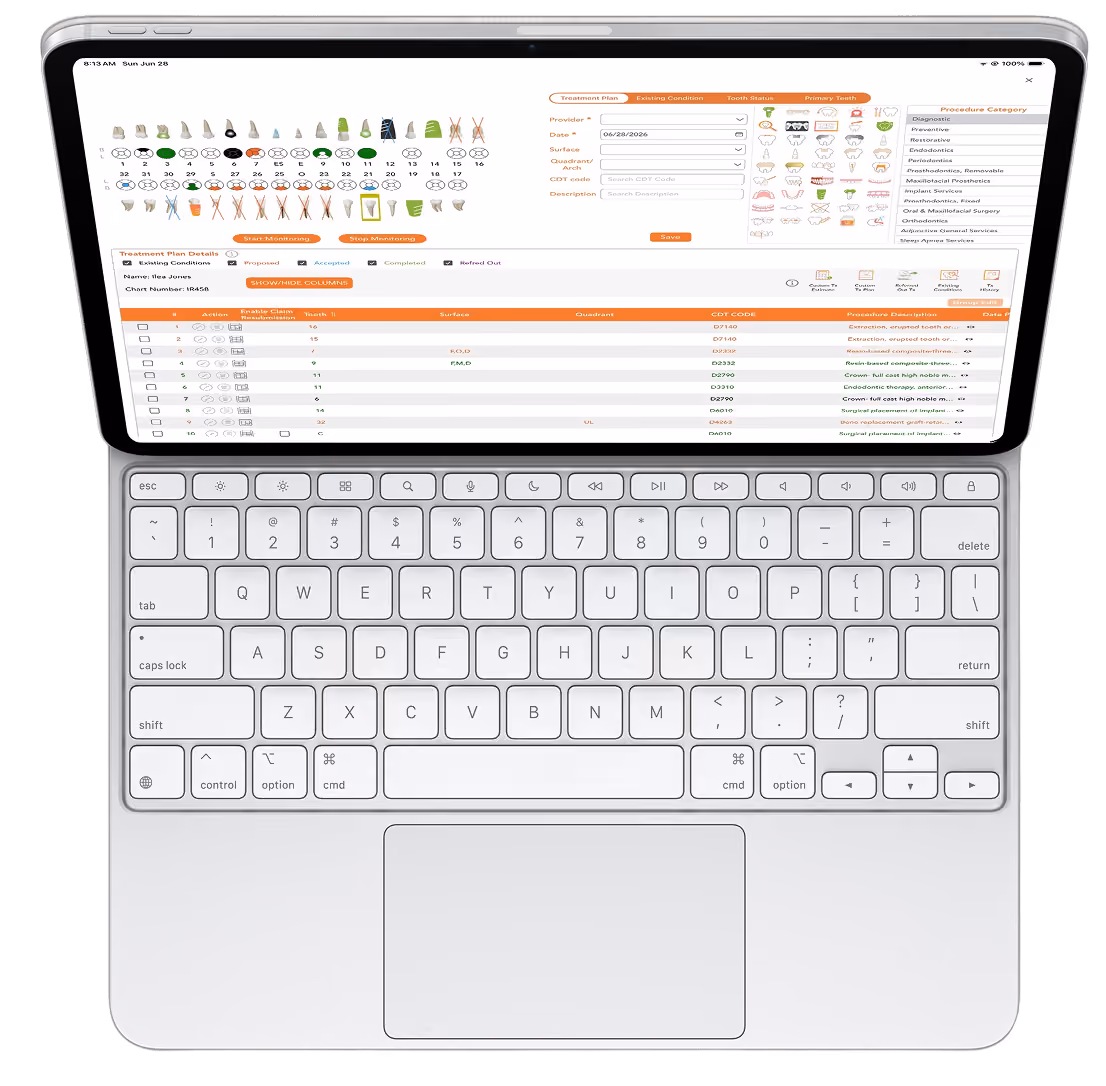 Top view of a laptop with dental treatment planning software and keyboard visible.