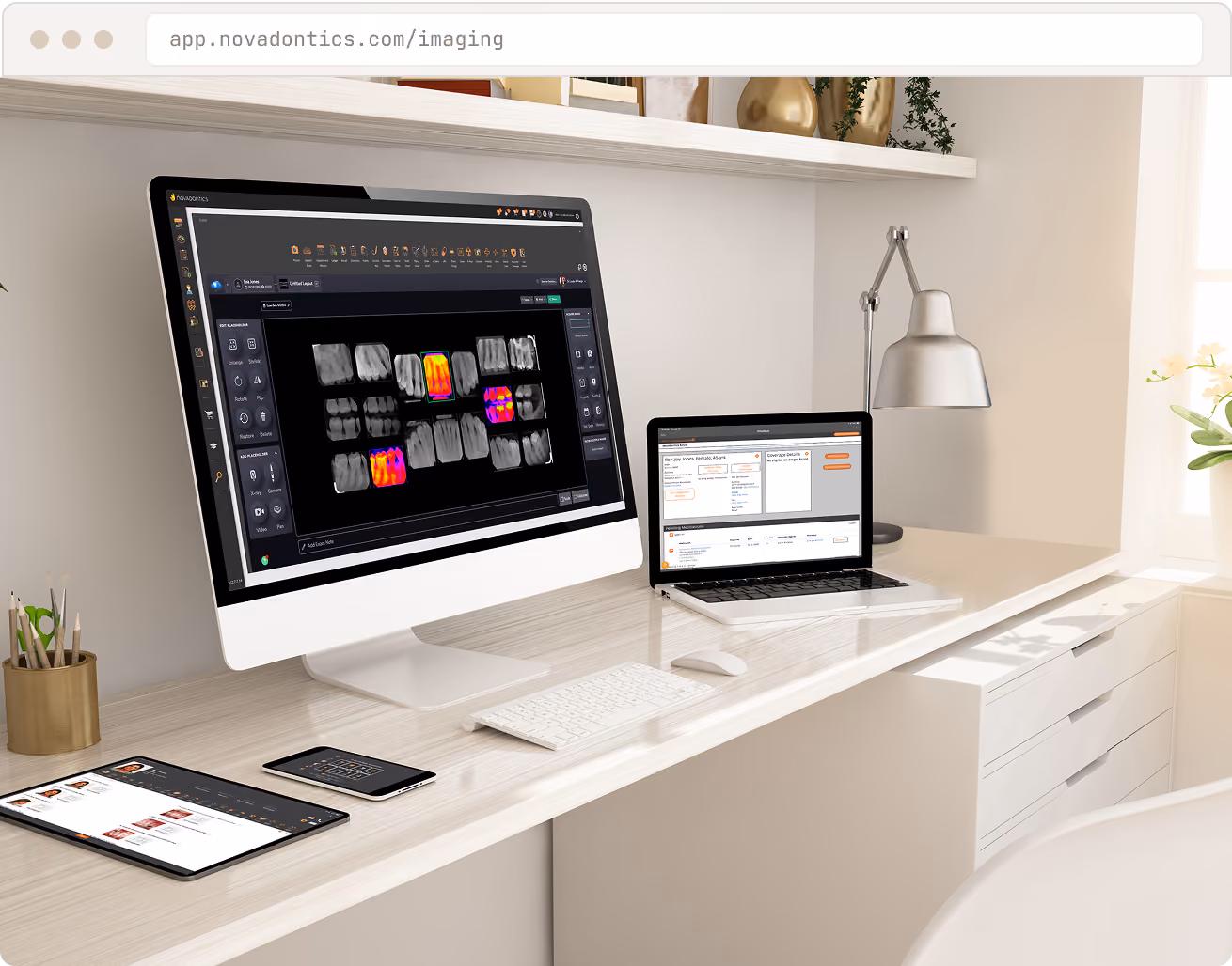 Desktop, laptop, tablet, and smartphone on desk showing dental imaging and patient data software.