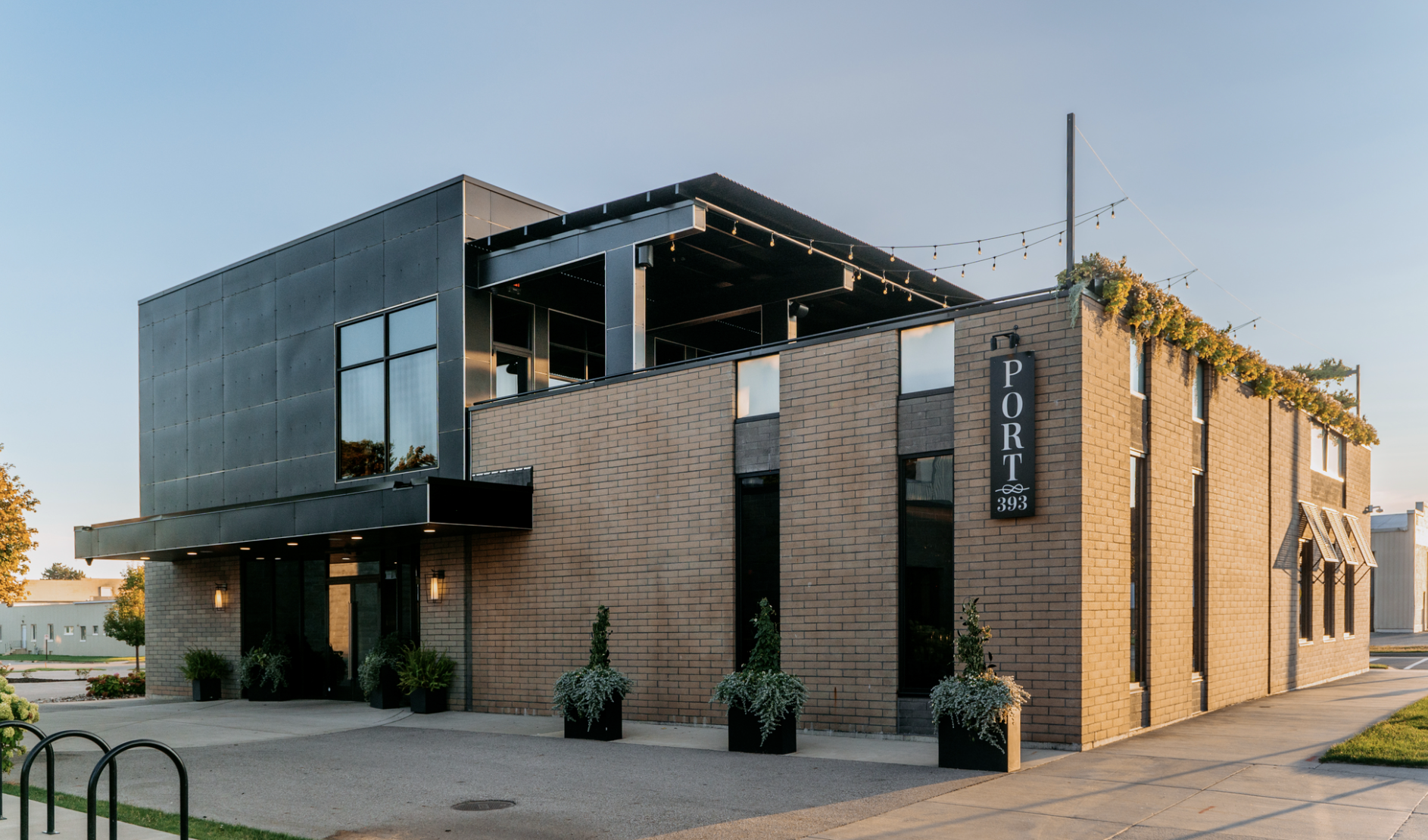 Port 393 modern industrial venue exterior in daytime with rooftop greenery