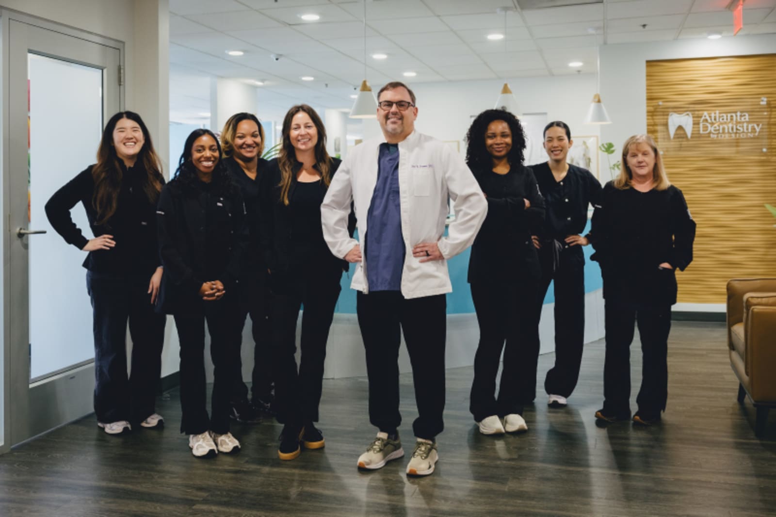 Atlanta Dentistry by Design team standing together in modern dental office