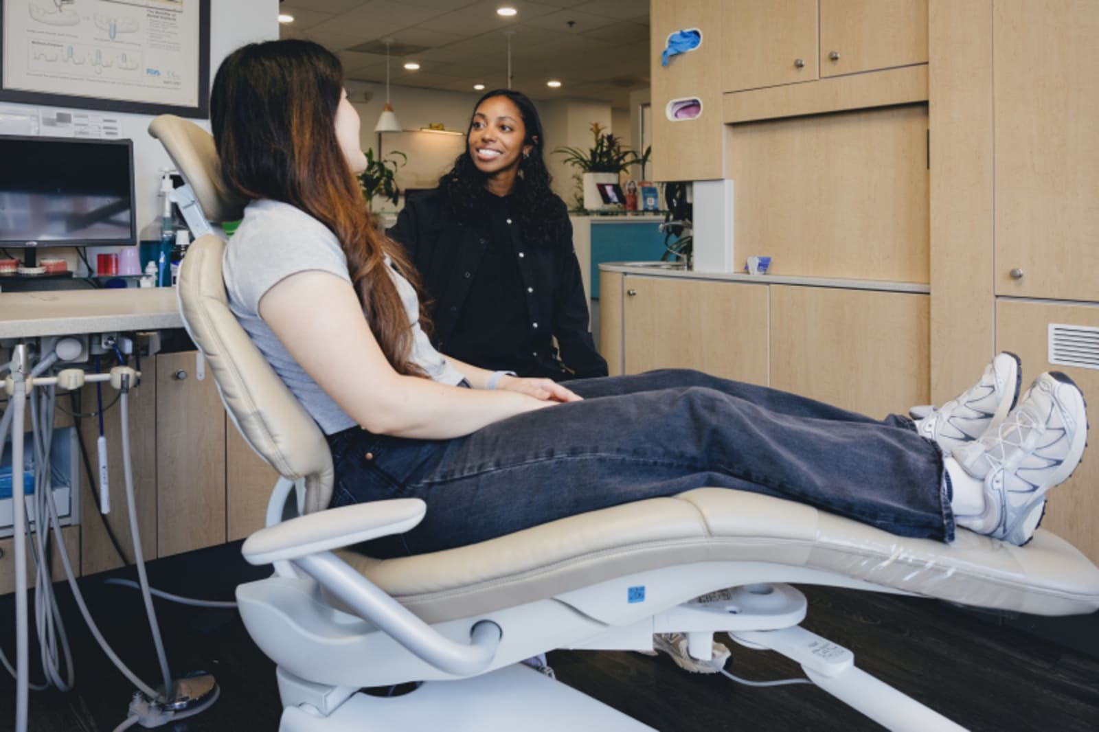 Patient reclined in dental chair during examination at Atlanta Dentistry by Design office.