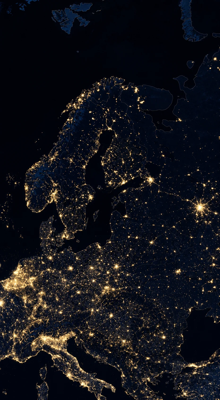 Satellite view of Europe at night, city lights glowing across the continent