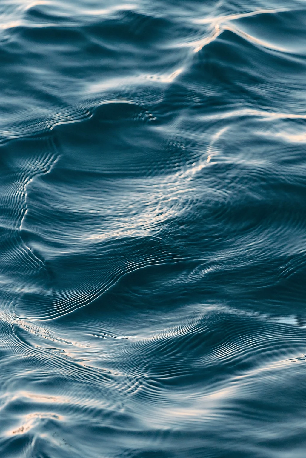 Close-up of rippling blue water catching the light