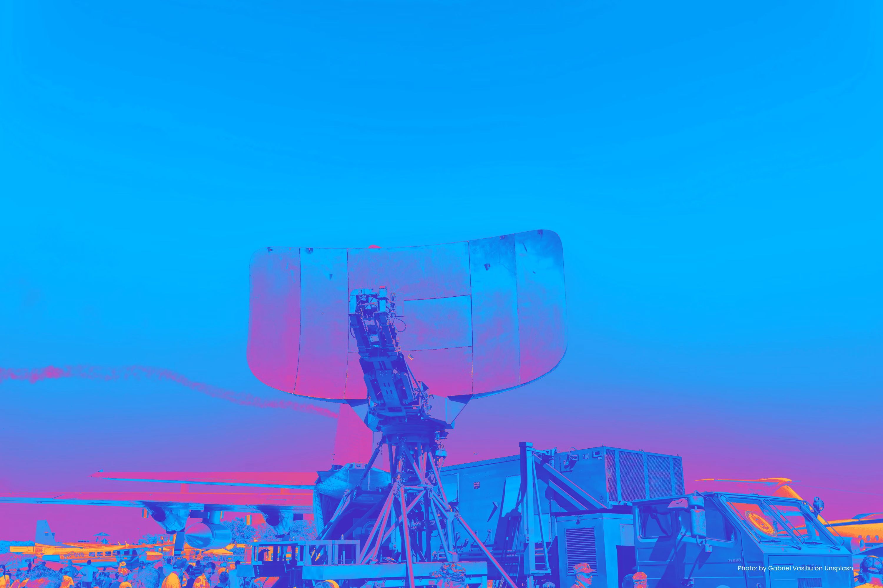 Military radar unit rendered in a blue and pink duotone treatment