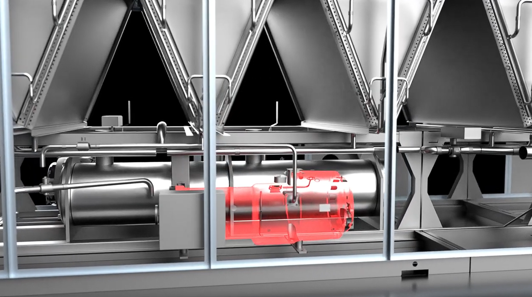 Close-up of a shiny industrial machine with a highlighted red cylindrical component in a metal frame.