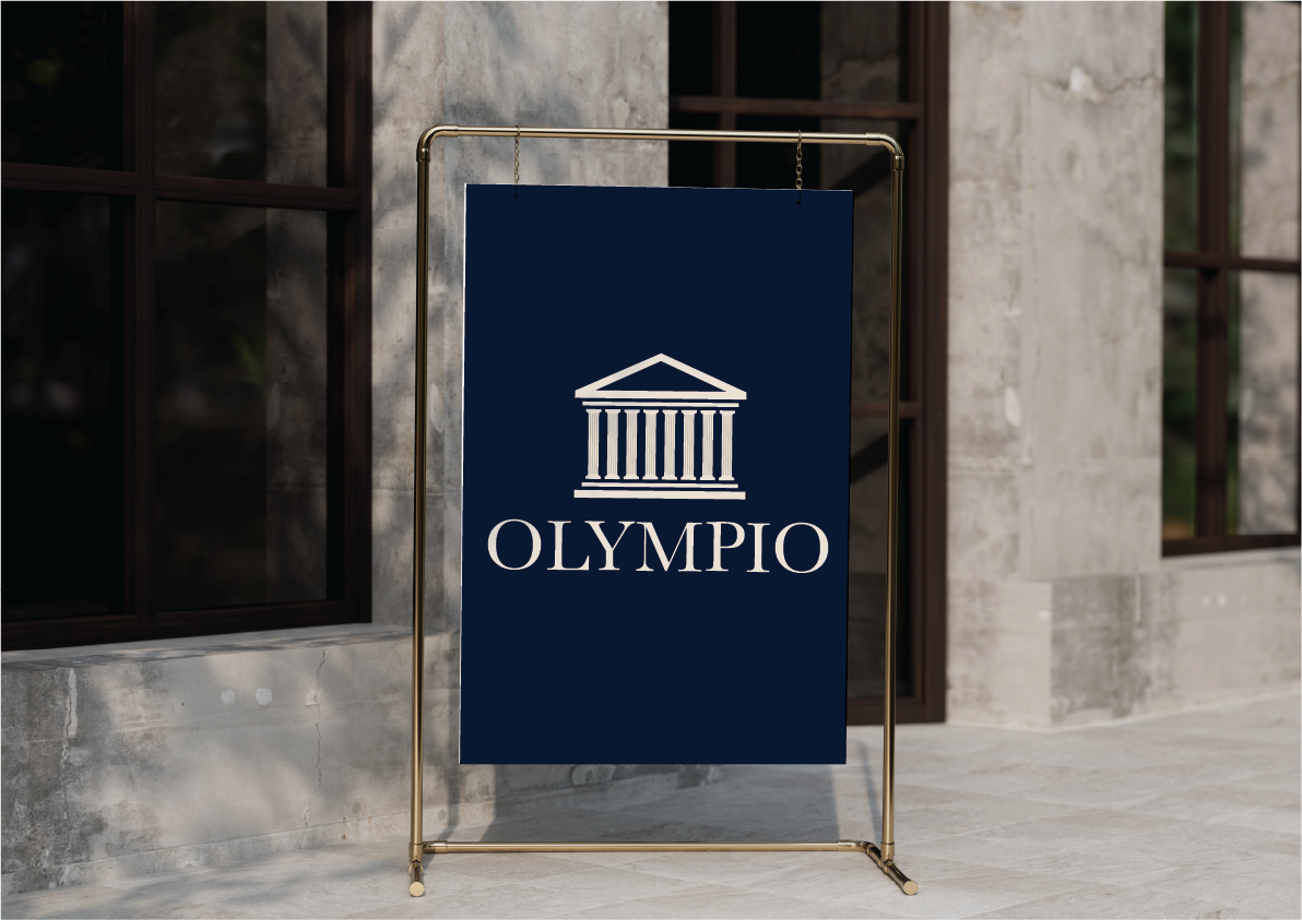 A navy blue sign hanging on a brass stand outside a building, featuring a white logo of a Greek-style temple with columns above the word 'OLYMPIO' in capital letters.