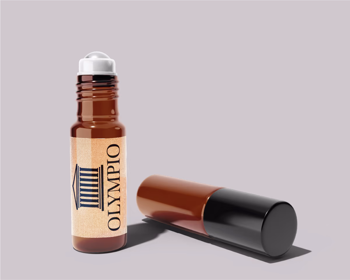 Brown amber glass roller bottle with a beige label that reads 'OLYMPIO' and a blue temple icon, next to its black and brown cap on a light gray background.