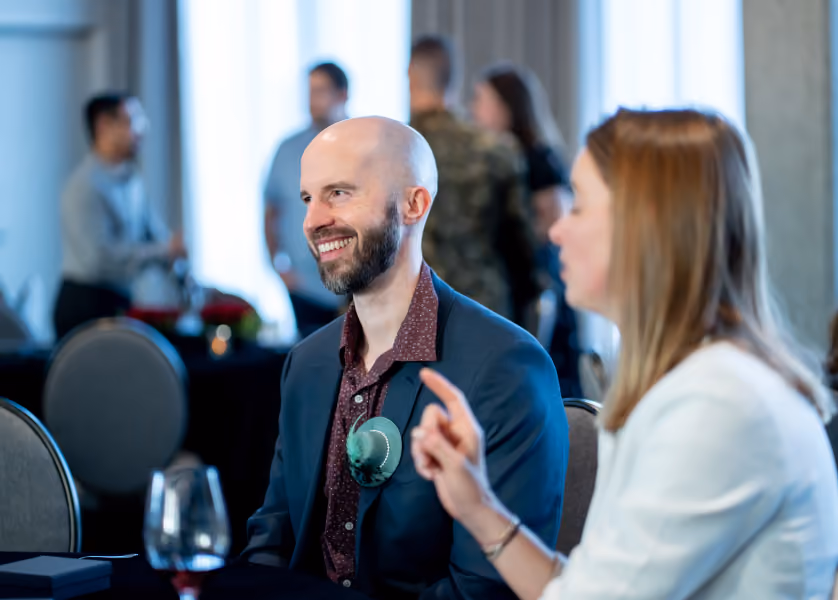 People chatting at a networking event.