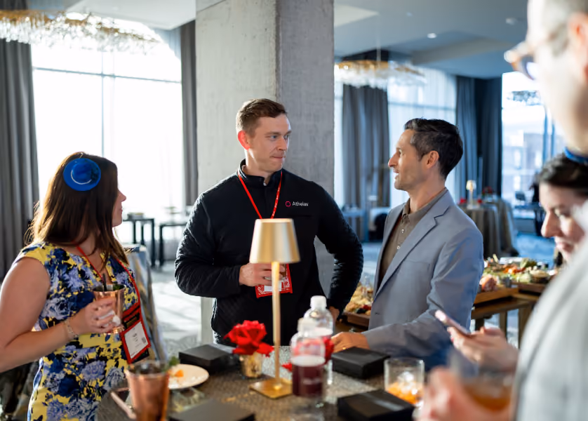 People talking and socializing at a networking event.
