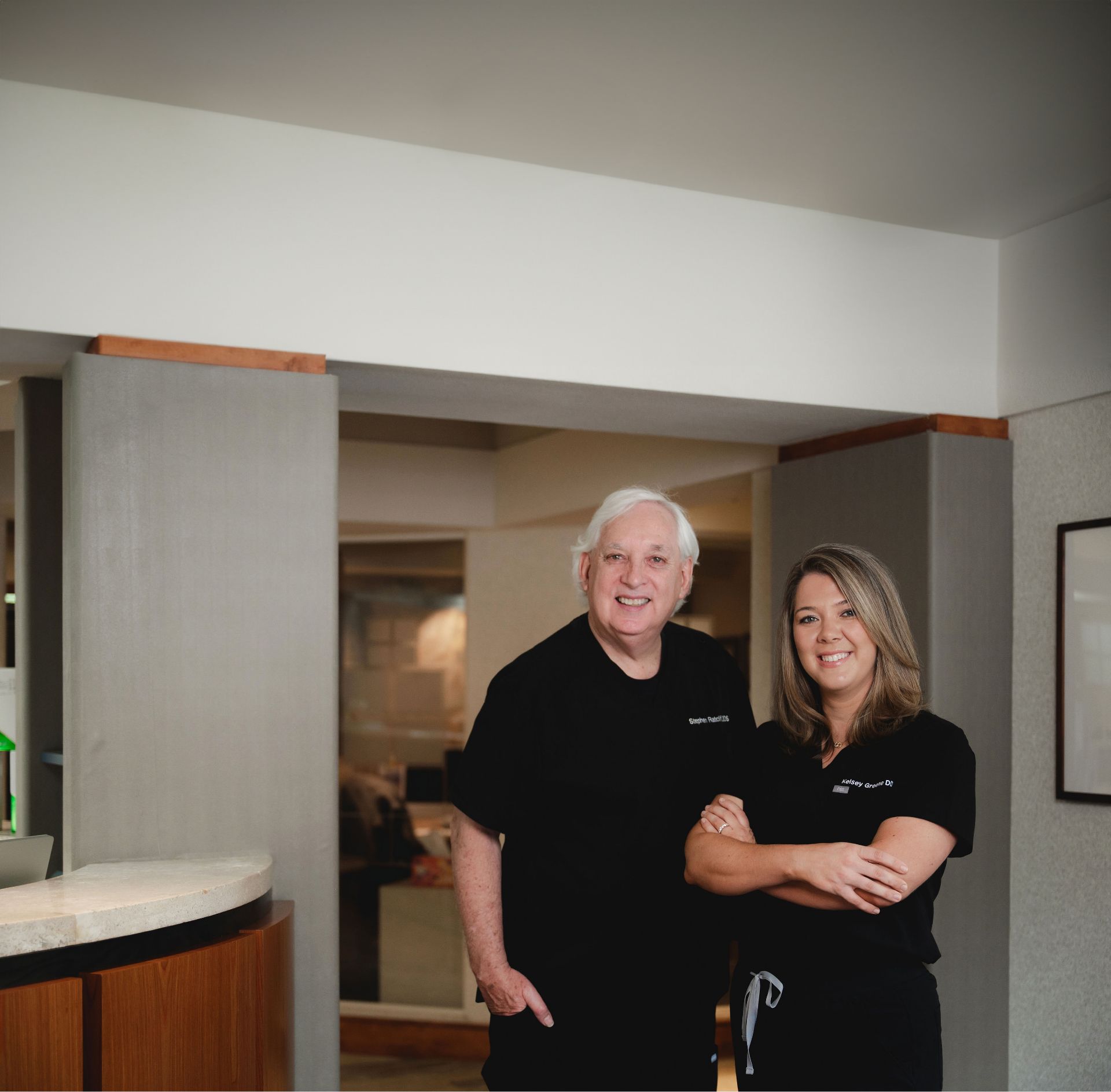 Dr. Ratcliff standing with a team member in the office.