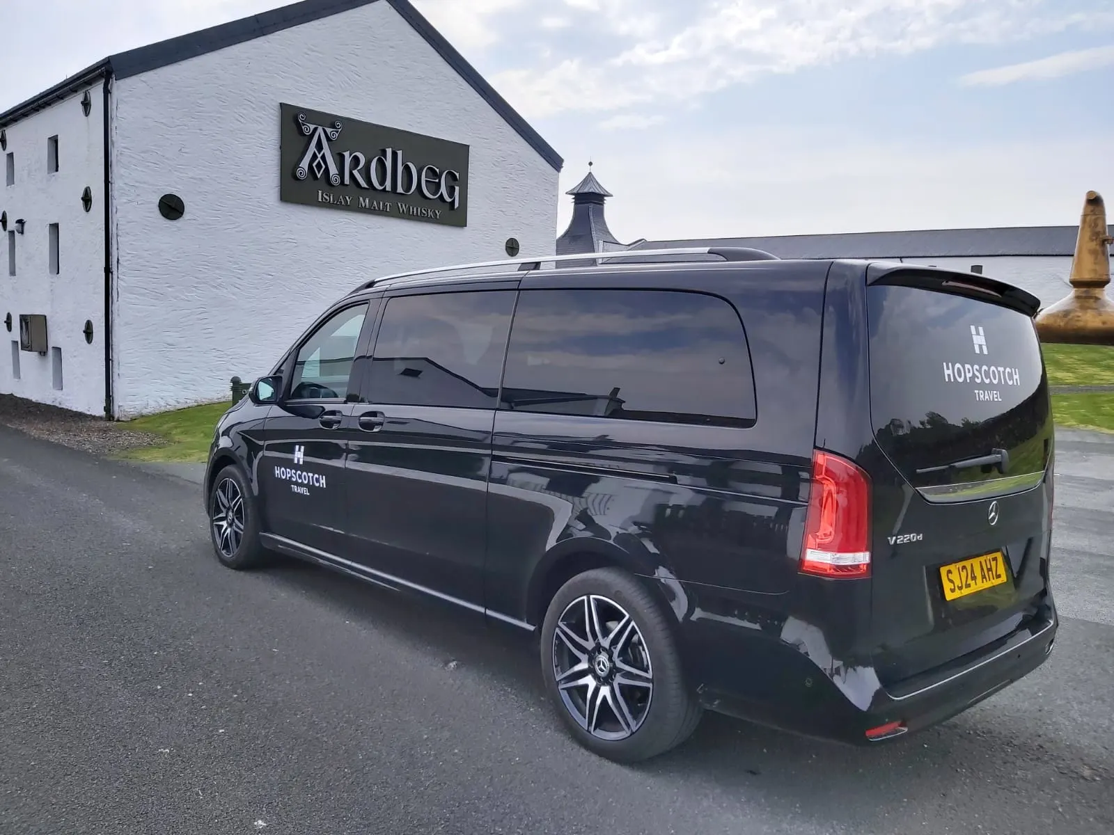 Hopscotch Travel van parked at Ardbeg whisky distillery on Islay, Scotland