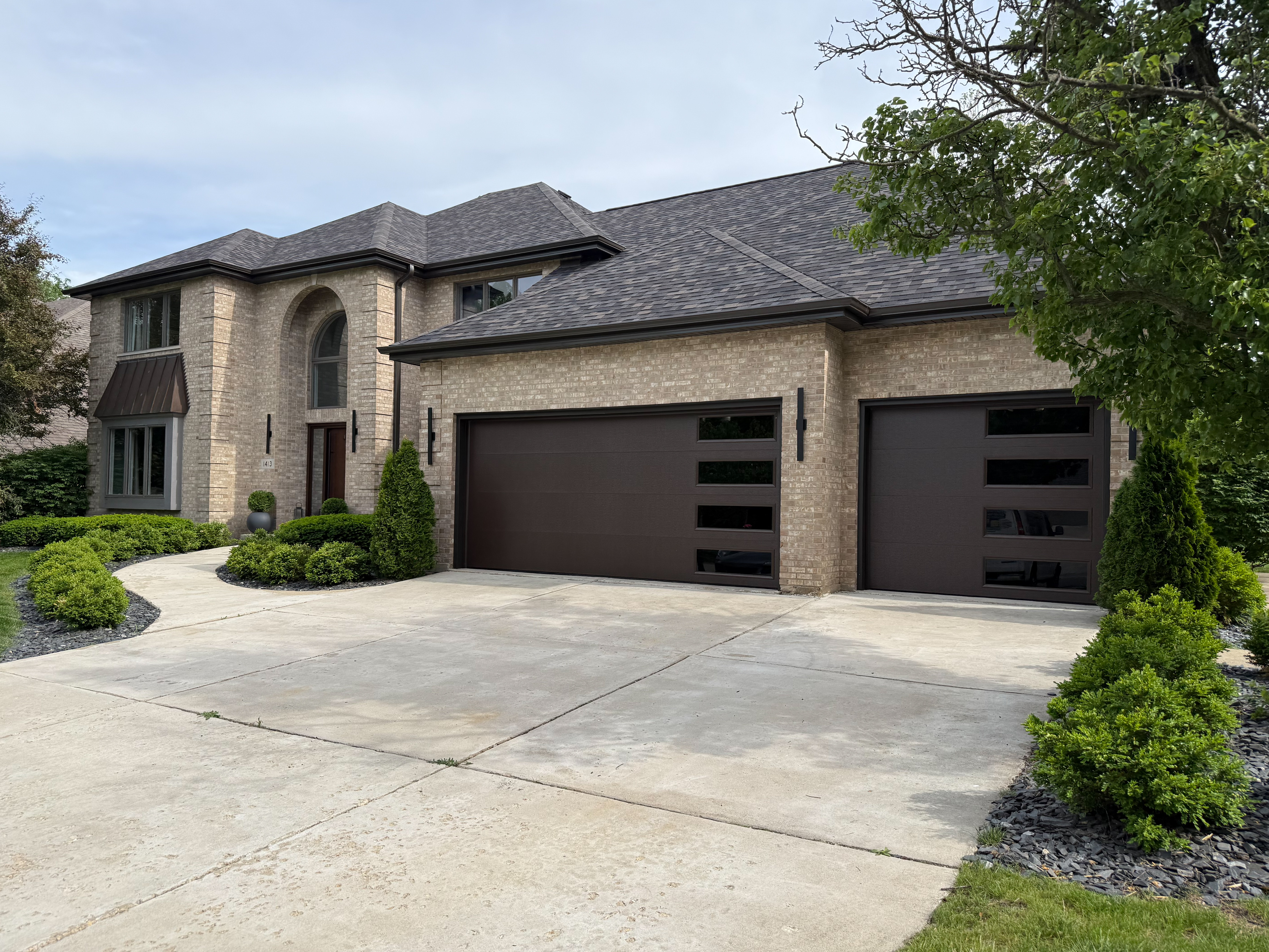 Modern residential garage doors served by 630 Overhead