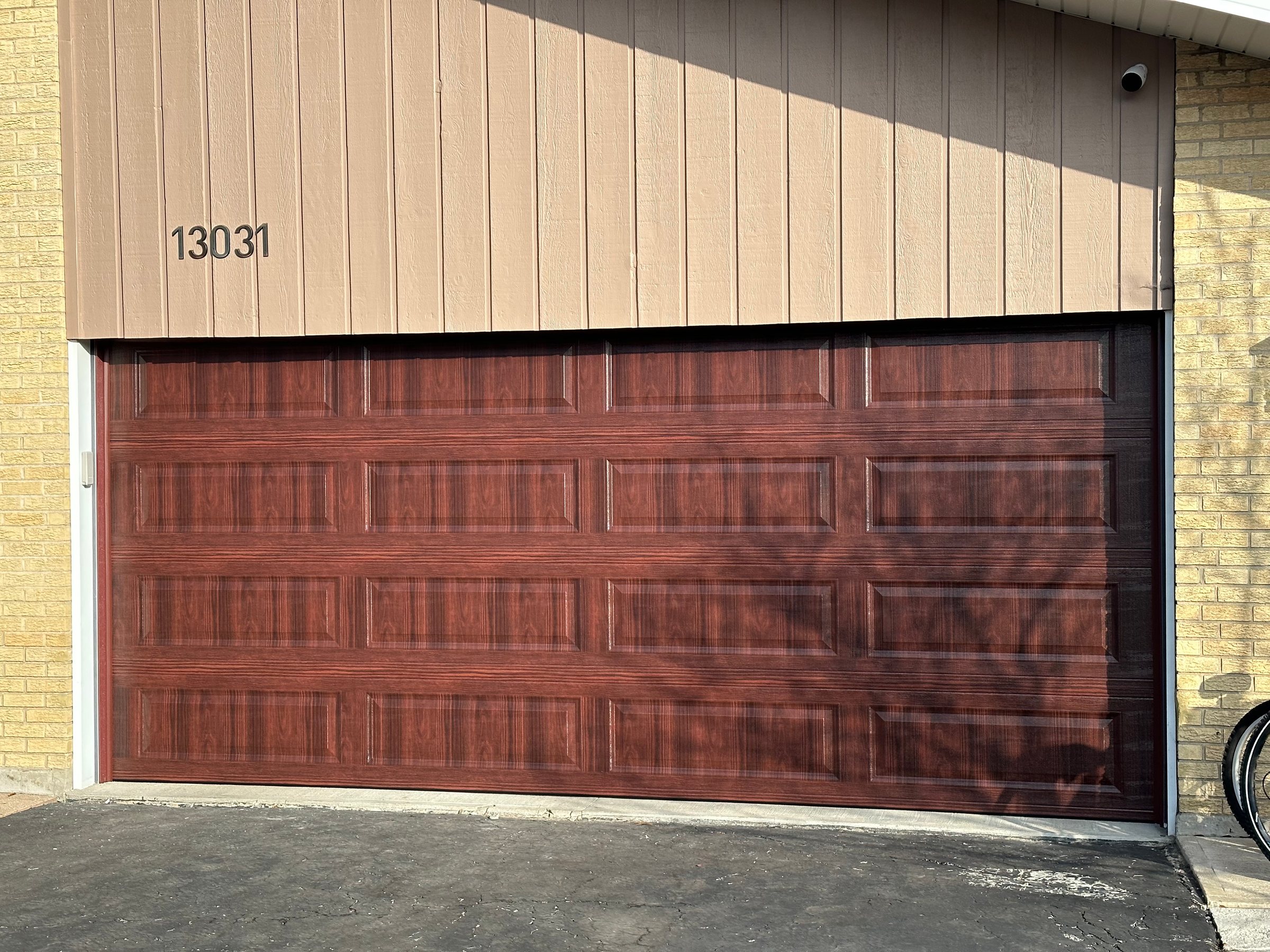 Wood-look garage door installation by 630 OVERHEAD