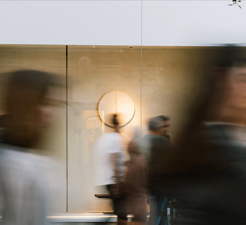 general counsel photo of people walking blurry