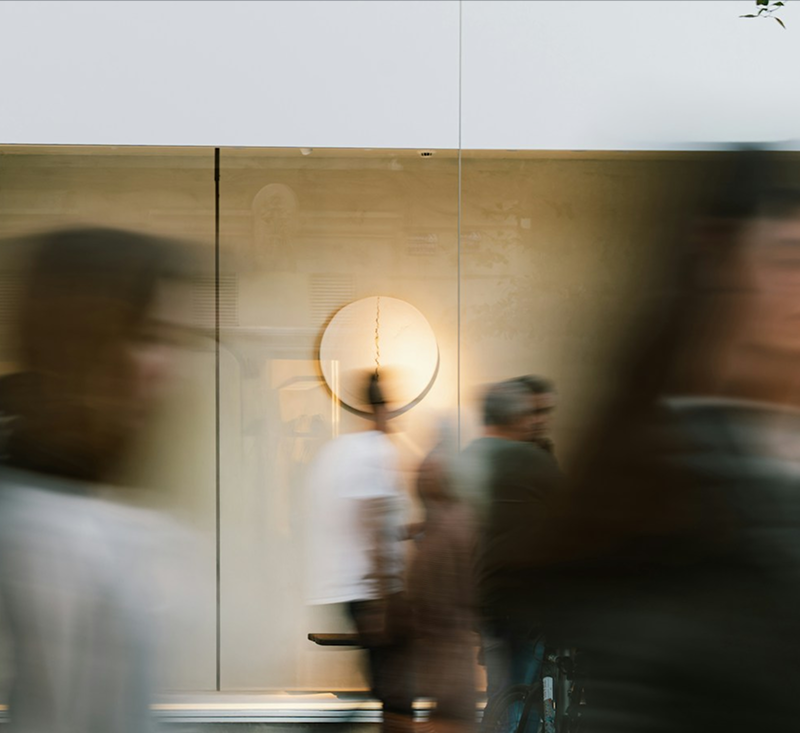 general counsel photo of people walking blurry