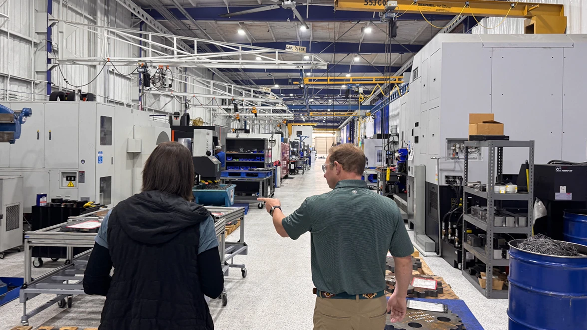 people inspecting a factory