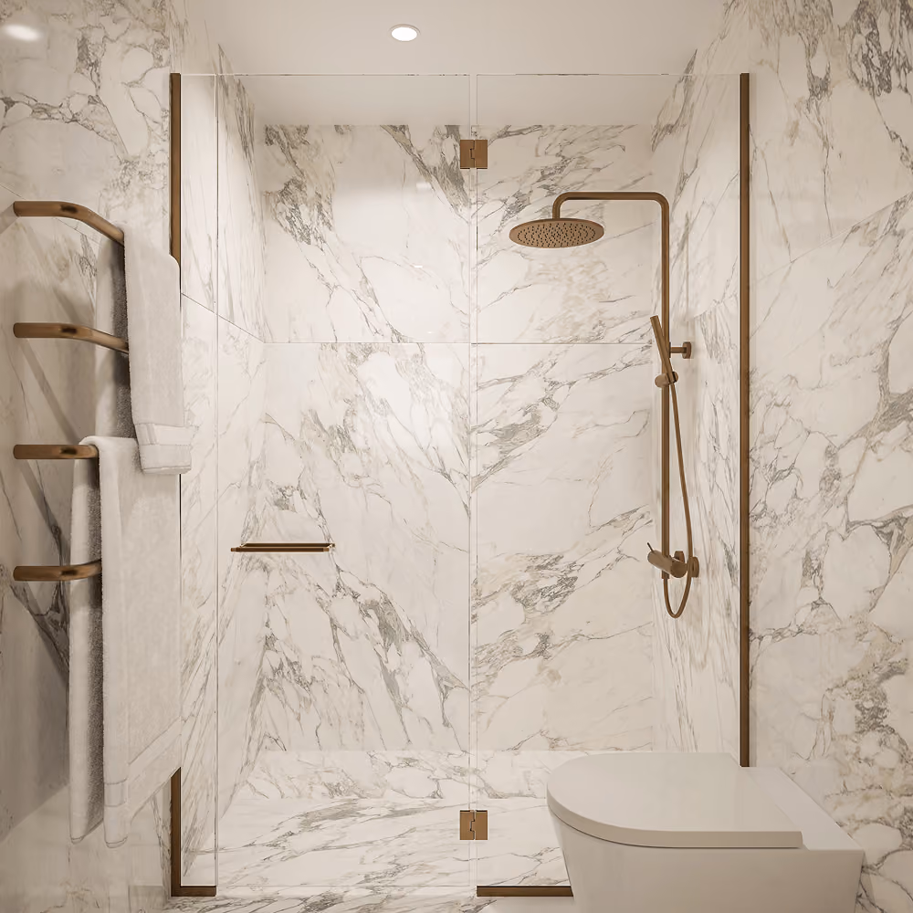 Modern bathroom with marble walls, glass shower enclosure, bronze fixtures, and a white toilet.