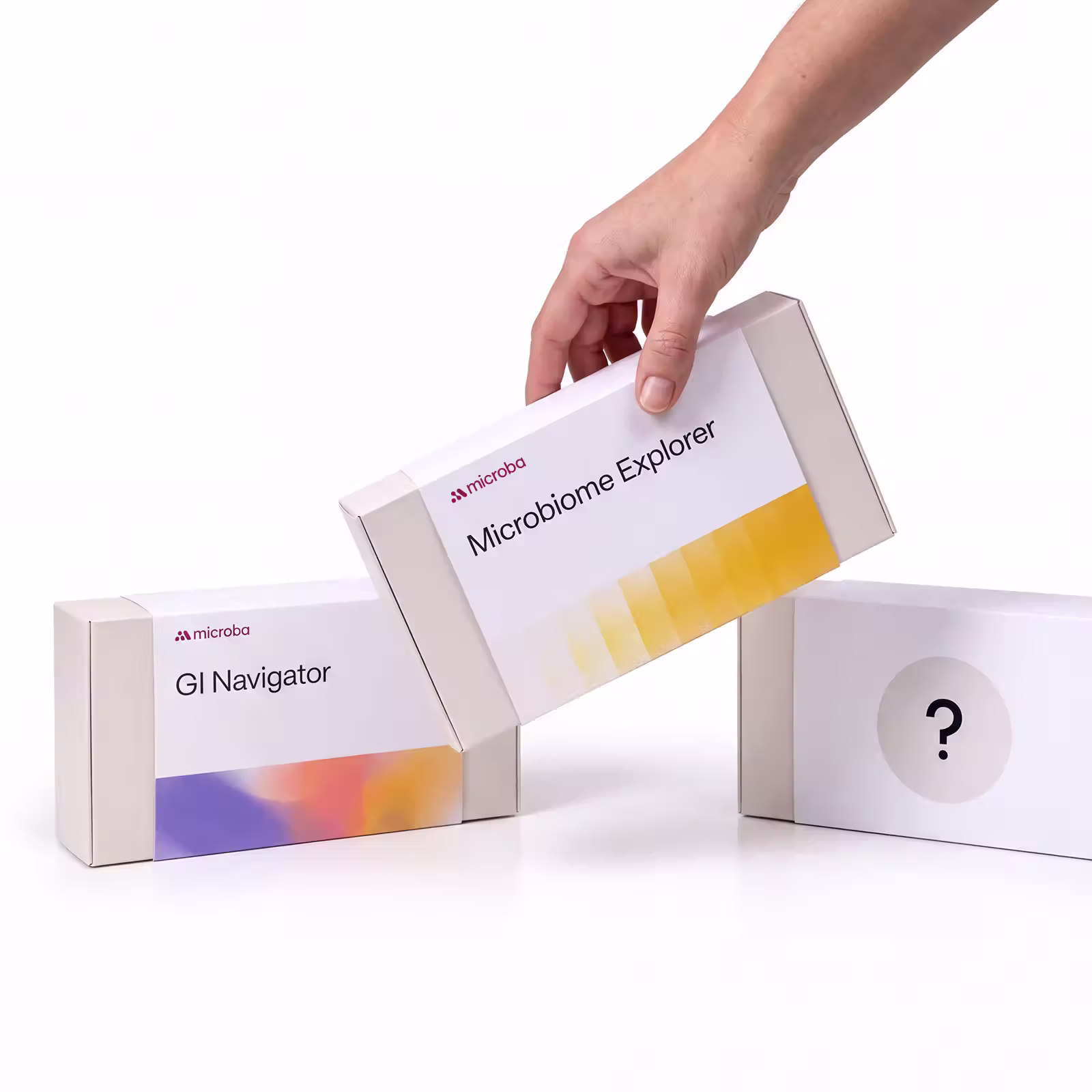 Microba GI Navigator and Microbiome Explorer kits beside an unmarked box with a question mark