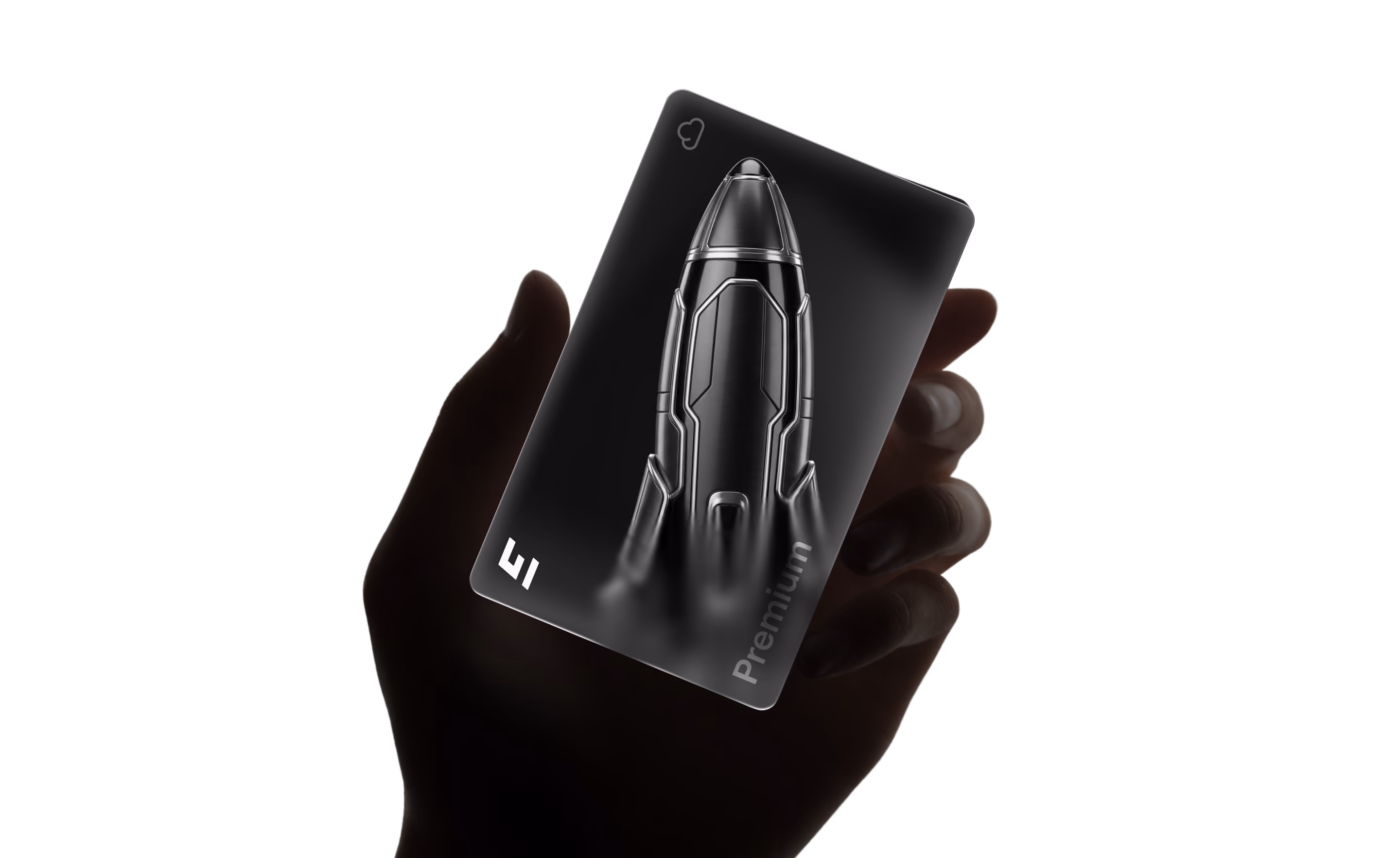 Hand holding a black card with a shiny silver rocket and the word Premium on it.