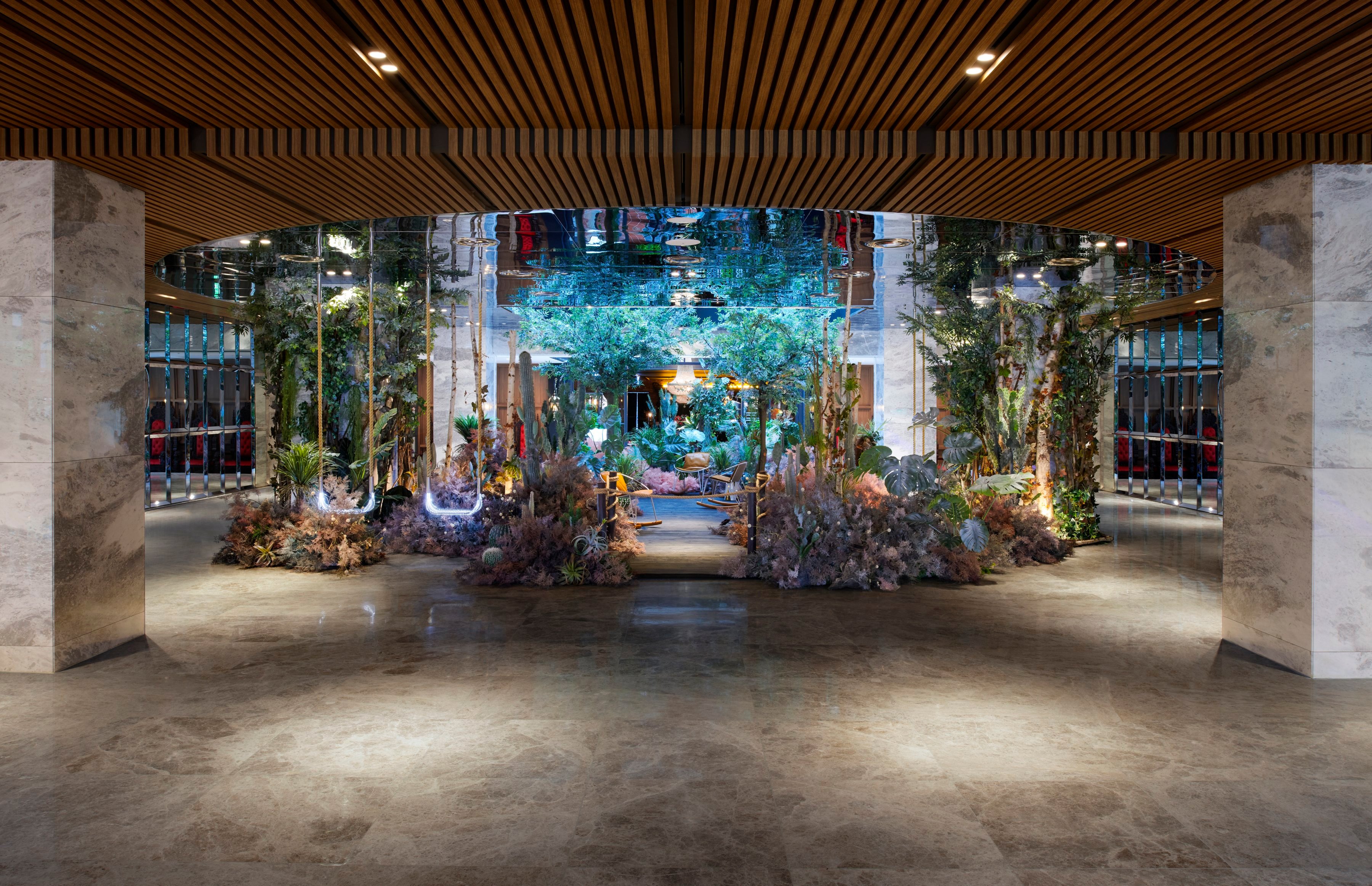 Indoor plants arranged in a forest-like setting