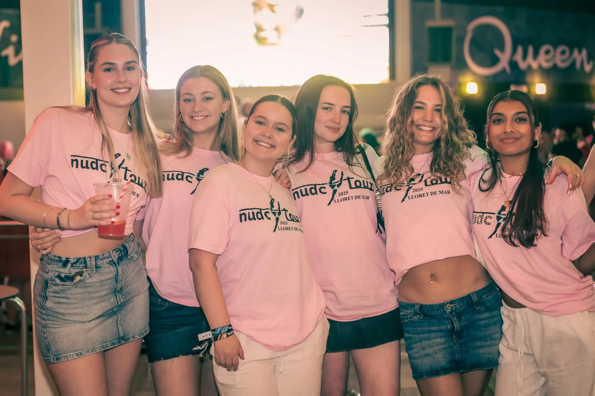 Outgoing festival ambassador team posing together at an event.