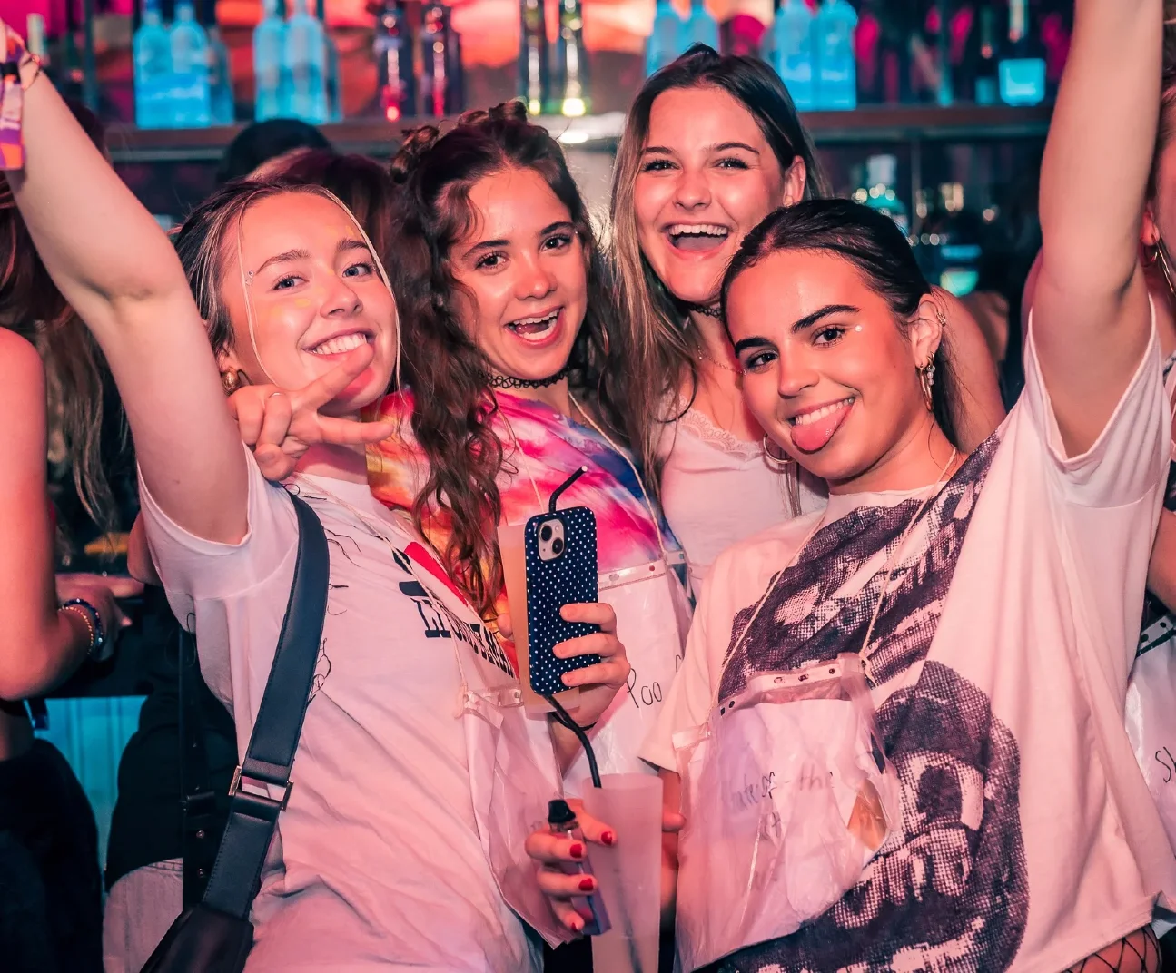 Friends enjoying a night out together at a nightclub.