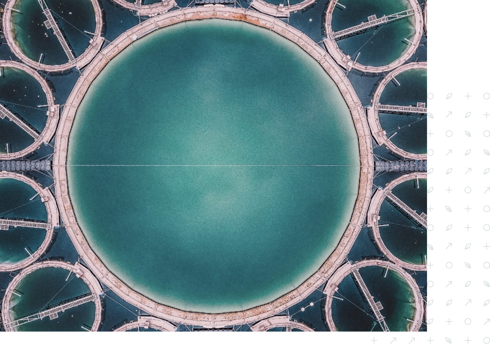 Aerial view of circular water treatment tanks with blue-green water and connected walkways.