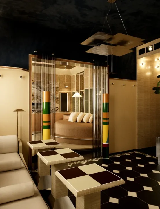 Salon de suite au style années 80 avec un canapé crème, des petites tables à carreaux et une alcôve abritant un lit circulaire encadré de colonnes multicolores.
